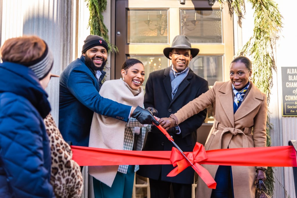 people cutting ribbon